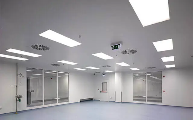 Spacious cleanroom with multiple ceiling-mounted LED lights and ventilation units.